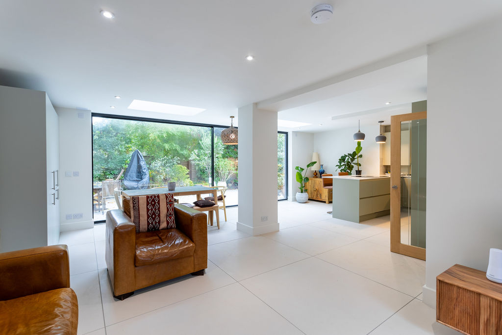 A completed Plan Hub project: a bright open-plan kitchen and living room opening onto the garden.